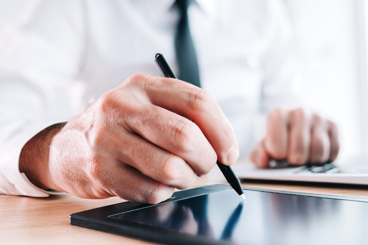 man esigning legal document